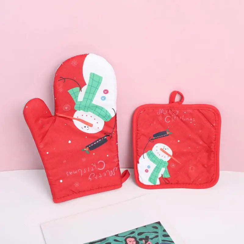 Red insulated oven mitts featuring a white snowman and Christmas design on a pink background.