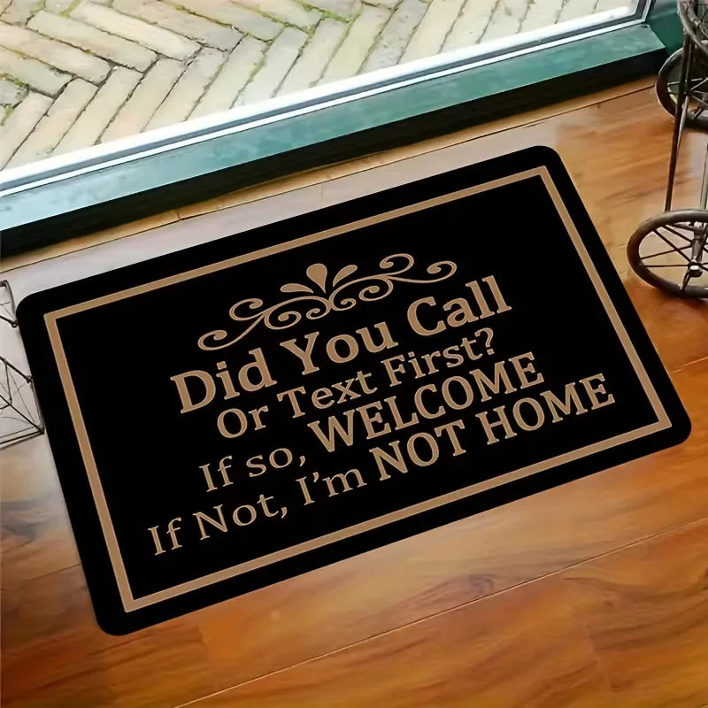 A black engraved sign on a wooden floor with text asking Did You Call Or Text First If so WELCOME If Not I'm NOT HOME