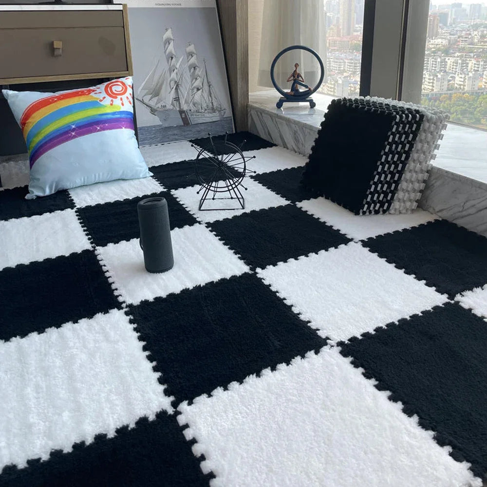 A black and white checkered floor mat with white plush tiles, a dark gray cylinder, and decorative items visible in the backg