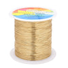 Spool of thin gold-colored copper clad steel wire for crafting and jewelry making