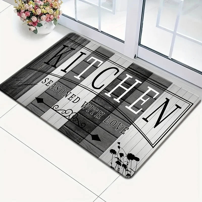 A rectangular black and white striped kitchen mat with the text SEASONED WITH LOVE