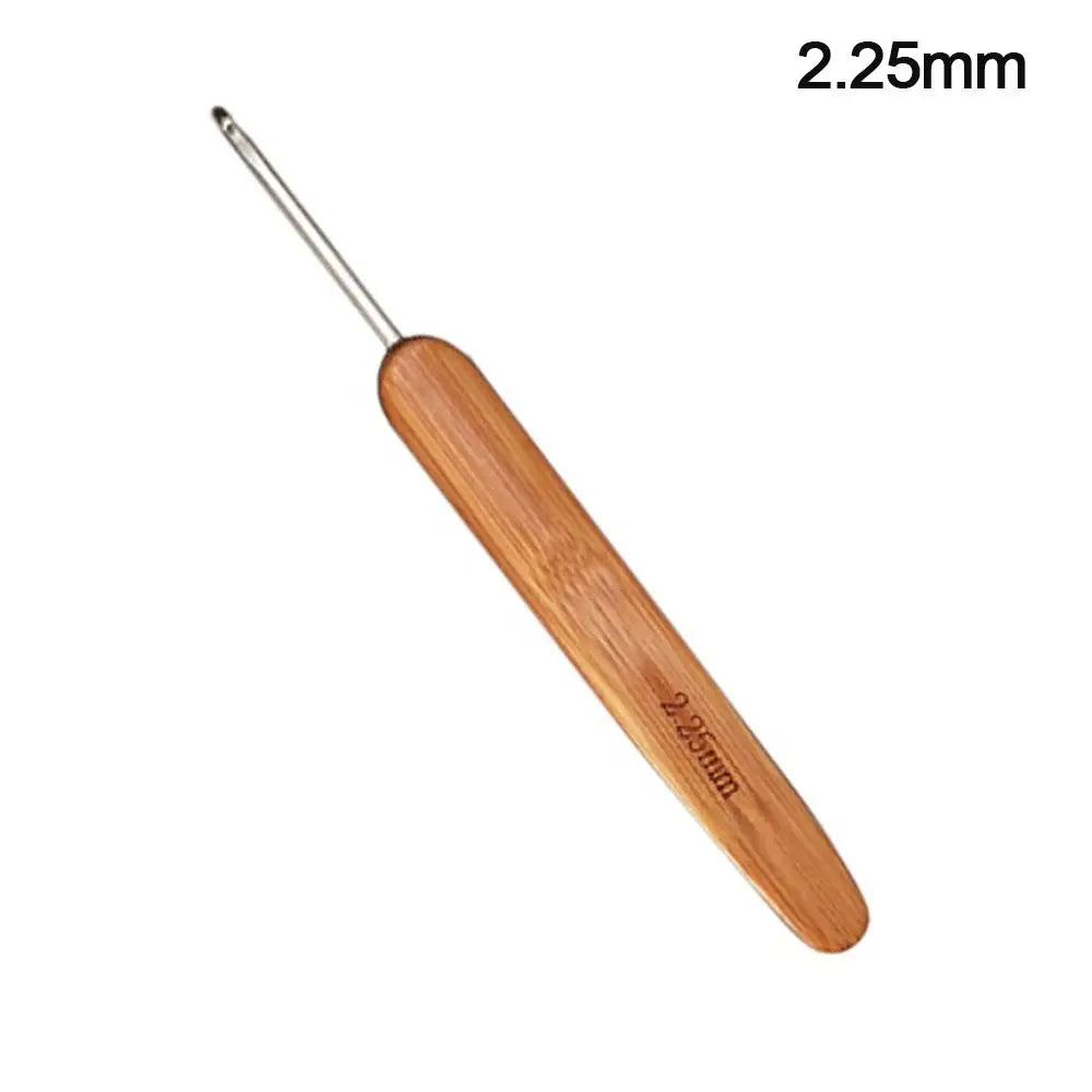 A pair of wooden crochet and knitting needles with a metal tip, labeled 2.25mm.