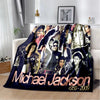 A dark blue flannel throw blanket featuring portraits of Michael Jackson and the years 1958-2009