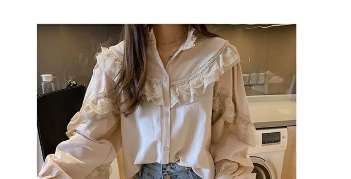 A white retro lace long sleeve blouse for women displayed in a mirror.