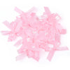 A pile of pink satin ribbon bows for craft and decoration