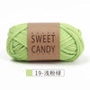 A ball of light green sweet candy yarn labeled in Japanese and English, ready for crochet or knitting.