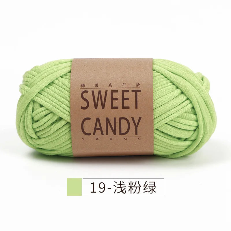 A ball of light green sweet candy yarn labeled in Japanese and English, ready for crochet or knitting.