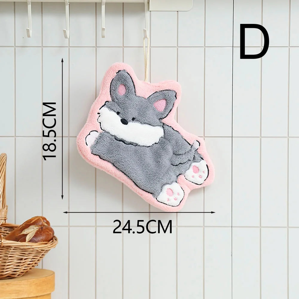 A pink and gray cartoon dog hanging hand towel with white accents, displayed against a white tiled background.