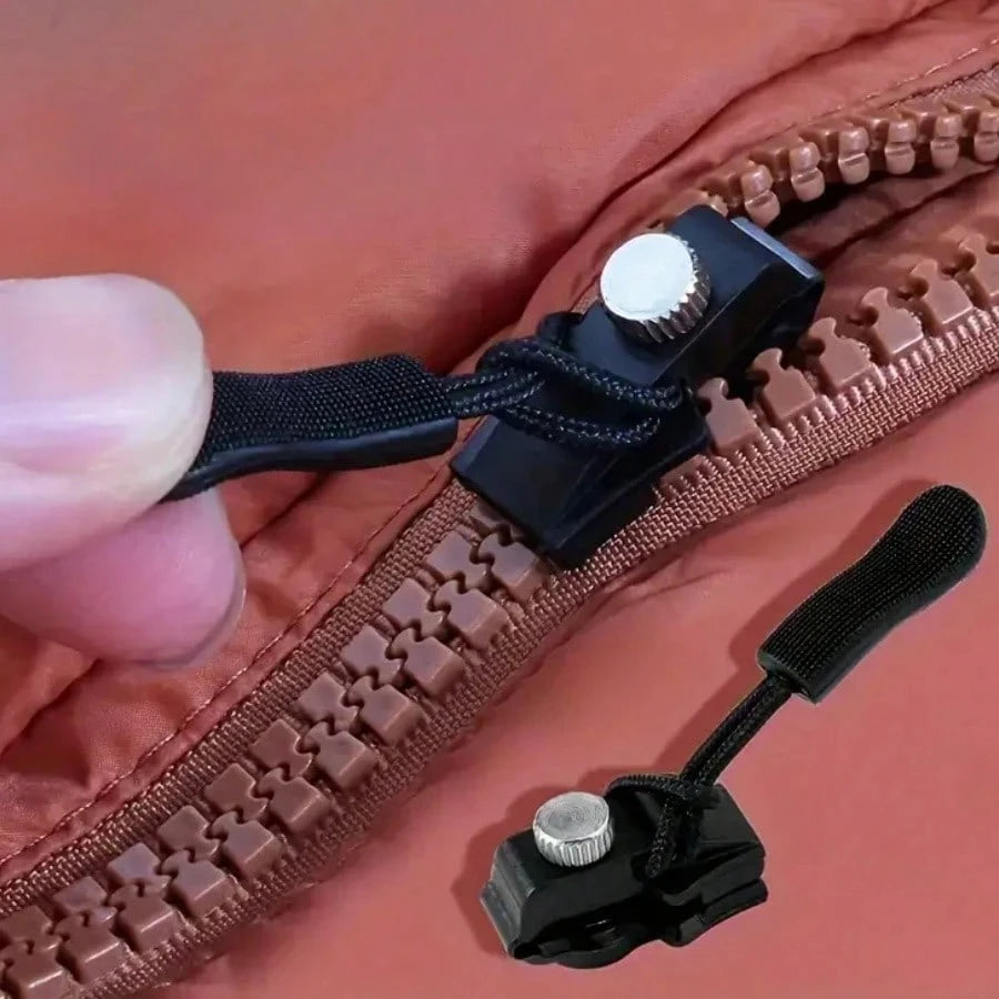 A close-up of a brown zipper with a black detachable repair kit attached to the teeth.