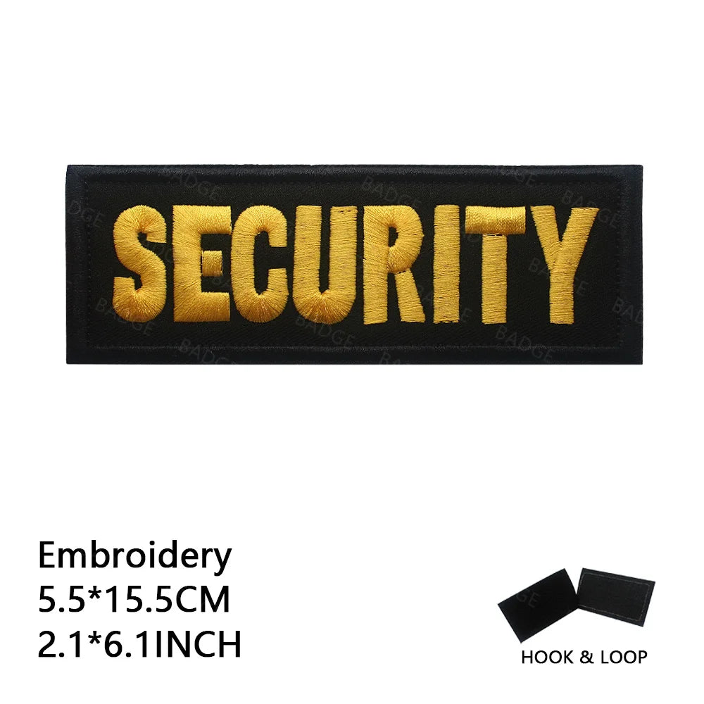 Black embroidered security patch with gold lettering on a black background