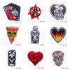 A collection of embroidered patches featuring skulls, punk symbols, and decorative designs.