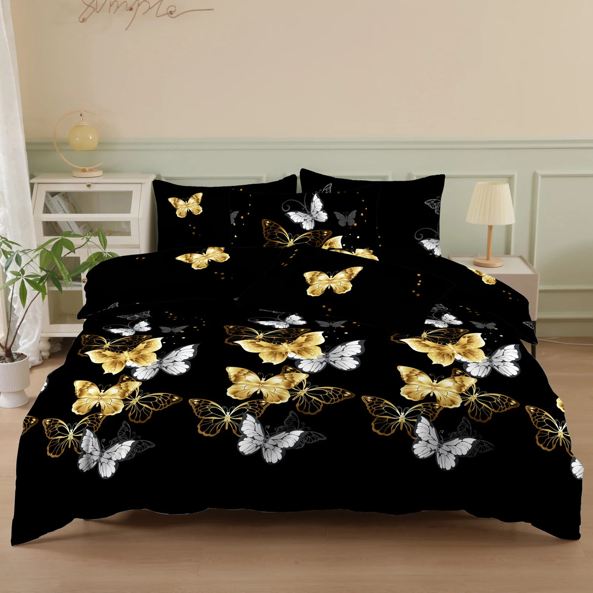 Black duvet cover set with a gold and white butterfly print and matching pillowcases