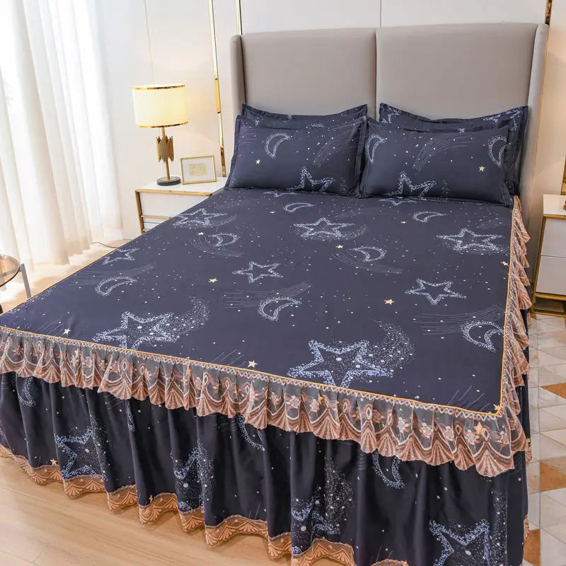 Dark blue bed skirt with silver star embroidery protecting a mattress.