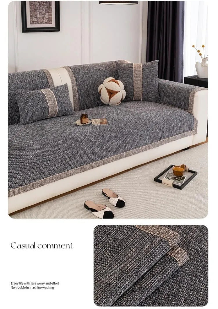A gray sofa cushion cover with beige trim and a textured fabric, shown on a light-colored sofa.