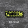 Yellow warning tape with black stripes, measuring 9x3cm.
