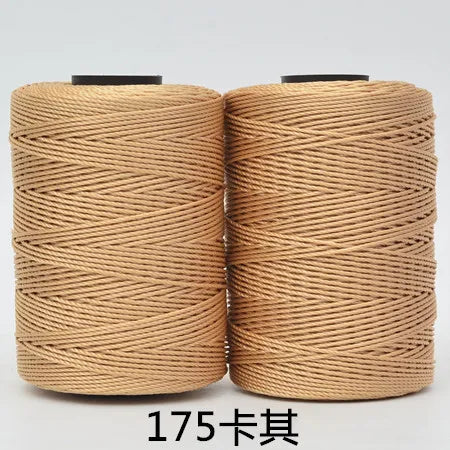 Spool of tan hand knitting and crochet cord for crafting