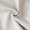 A close-up of an autumn fall leaves table runner with white pumpkins fabric texture.