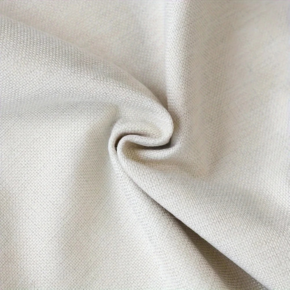 A close-up of an autumn fall leaves table runner with white pumpkins fabric texture.