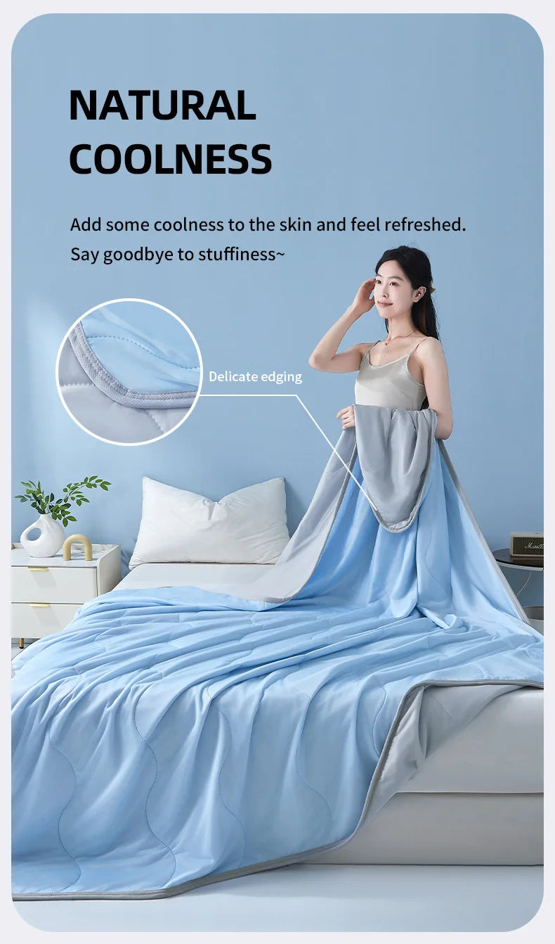 A light blue summer wave grid quilt is displayed on a bed, emphasizing natural coolness and a delicate edge.