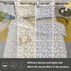 A set of heart print duvet covers in light gray and beige tones displayed with different lighting options.