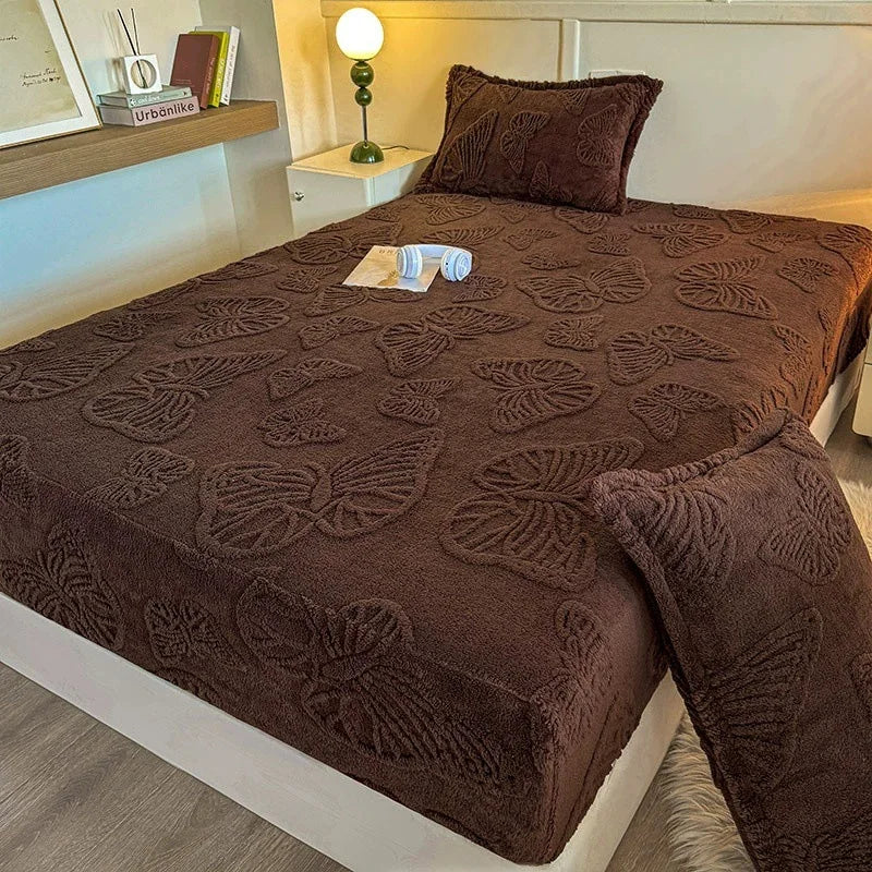 A dark brown jacquard weave fitted sheet bedding on a bed with a bedside lamp and wooden shelf.