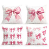 Decorative pillow covers featuring pink satin bows in various patterns and shades.