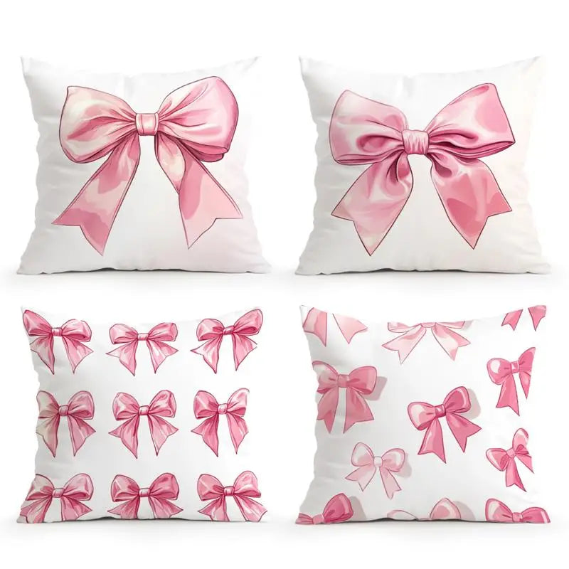 Decorative pillow covers featuring pink satin bows in various patterns and shades.