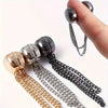 A close-up of adjustable hem t-shirt shorteners in various metallic finishes and chain lengths.