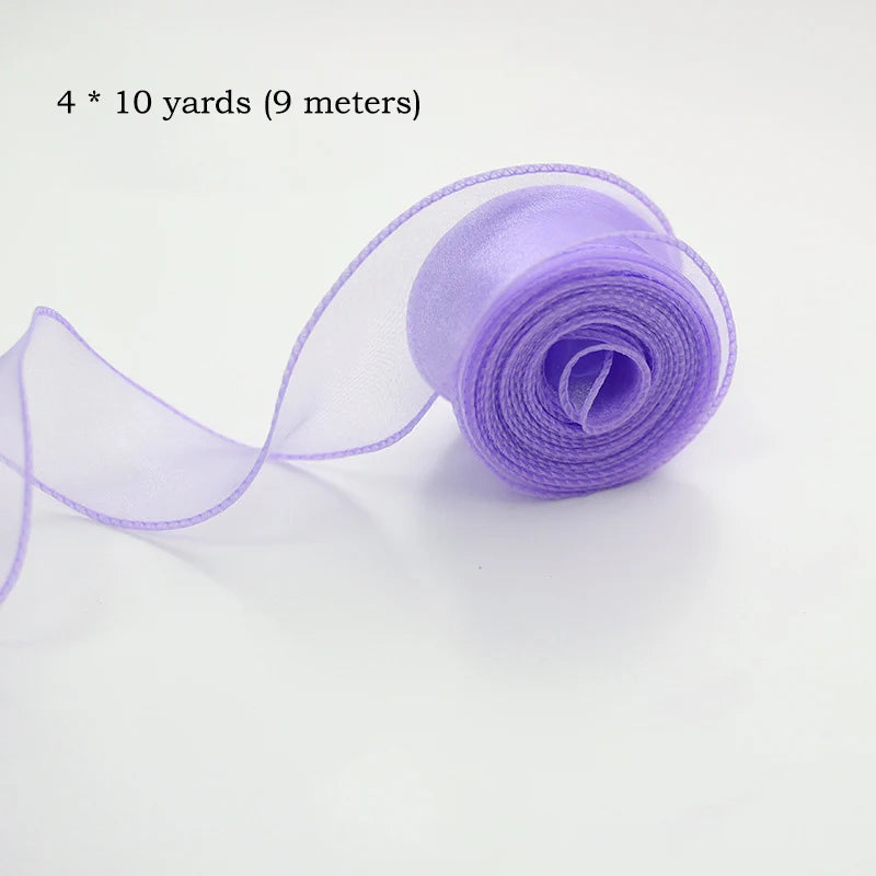 A roll of light purple silky organza ribbon measuring 4 by 10 yards.
