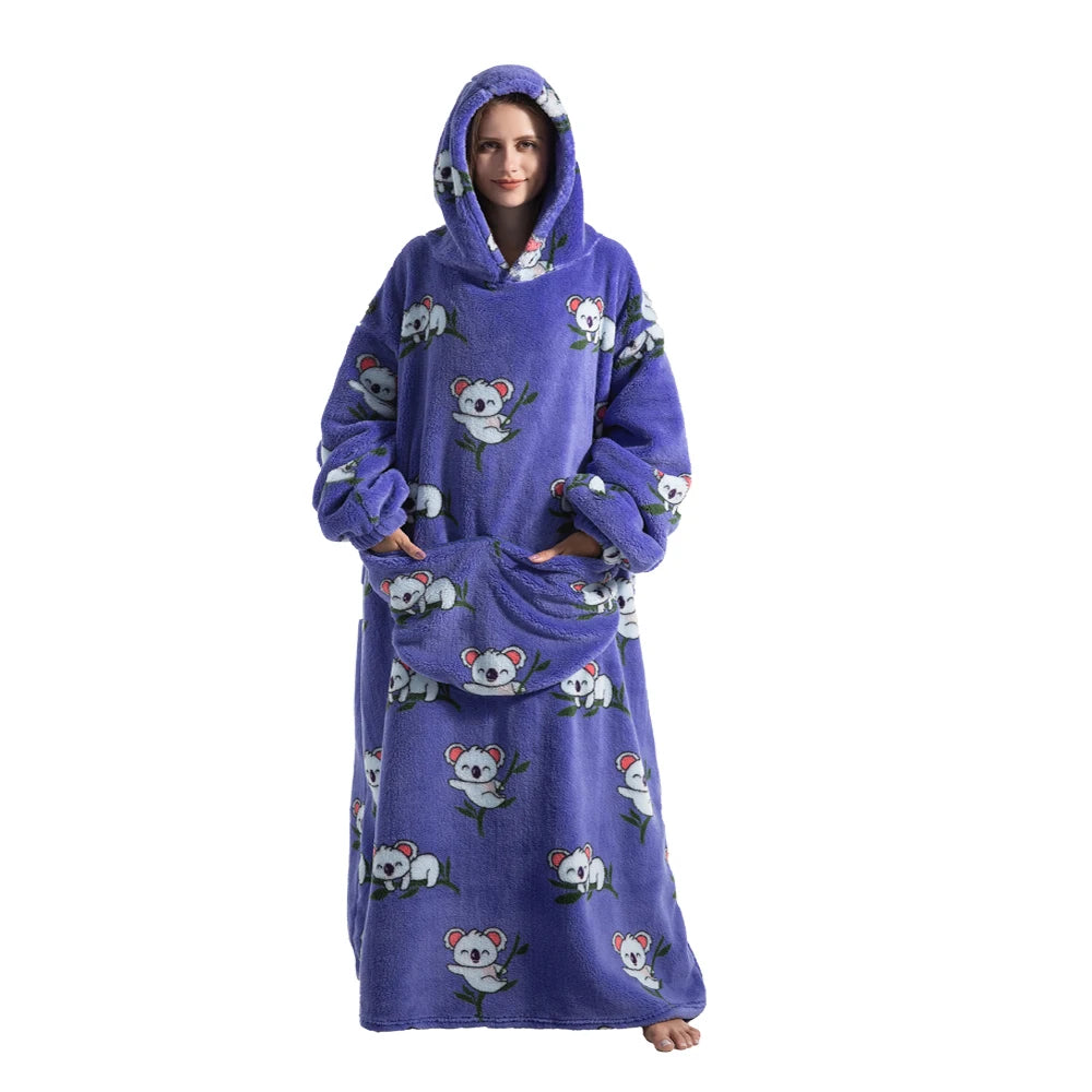 A woman wearing a purple sherpa fleece oversized blanket hoodie with white bear graphics.