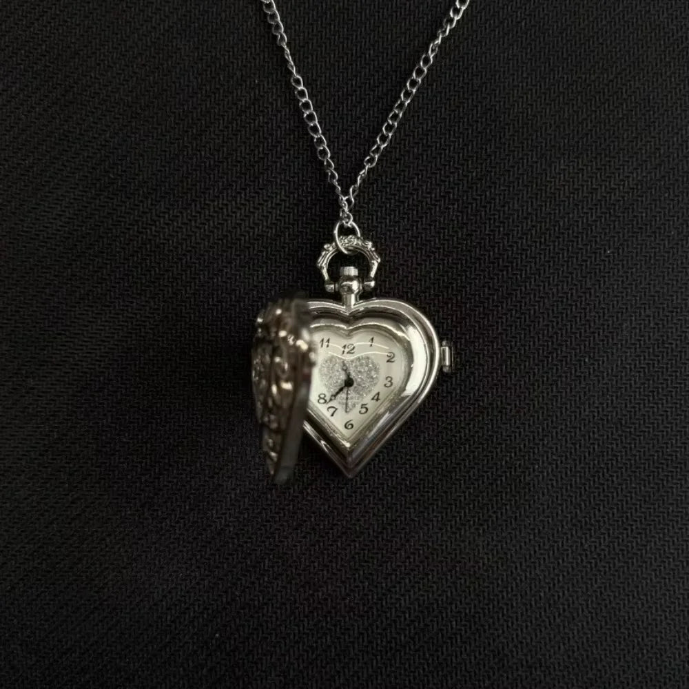 Silver heart-shaped pocket watch keychain with a chain and adjustable clock face