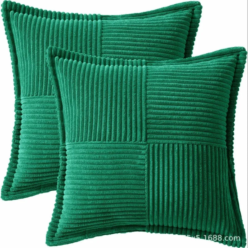 A set of emerald green striped corduroy lumbar support pillow cushions.