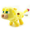 A yellow stuffed dragon plush toy with light brown features and geometric markings.