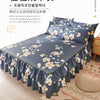 A dark blue bed featuring a ruffled skirt with white floral print, showcasing the double layer printed bed skirt.