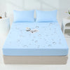 Light blue waterproof mattress and bed protector sheet with scattered water droplets on a bed.