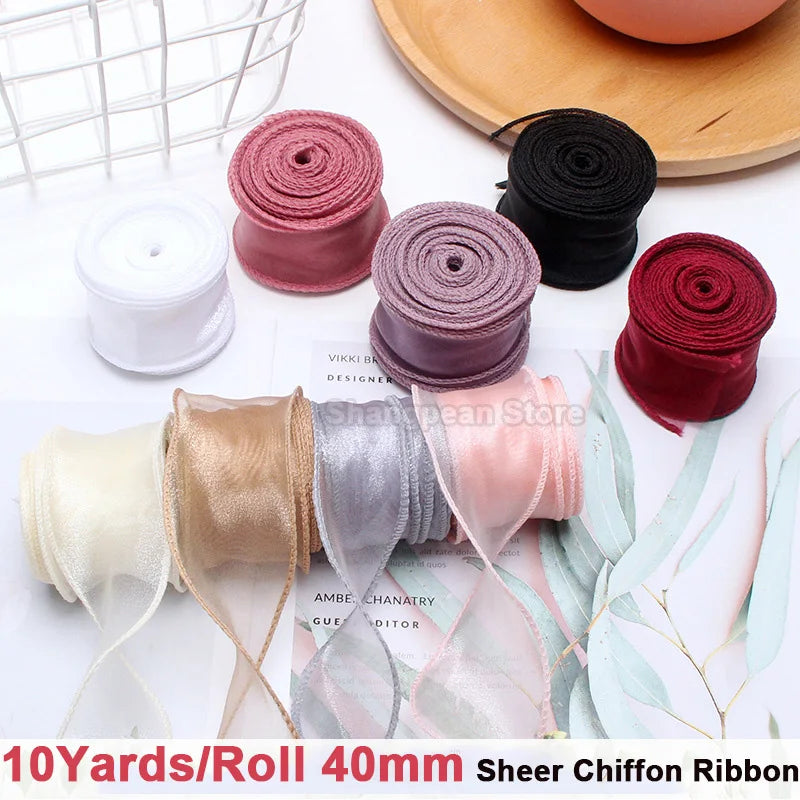 Rolls of sheer chiffon ribbon in various colors including pink, gold, silver, and red for gift wrapping and crafts