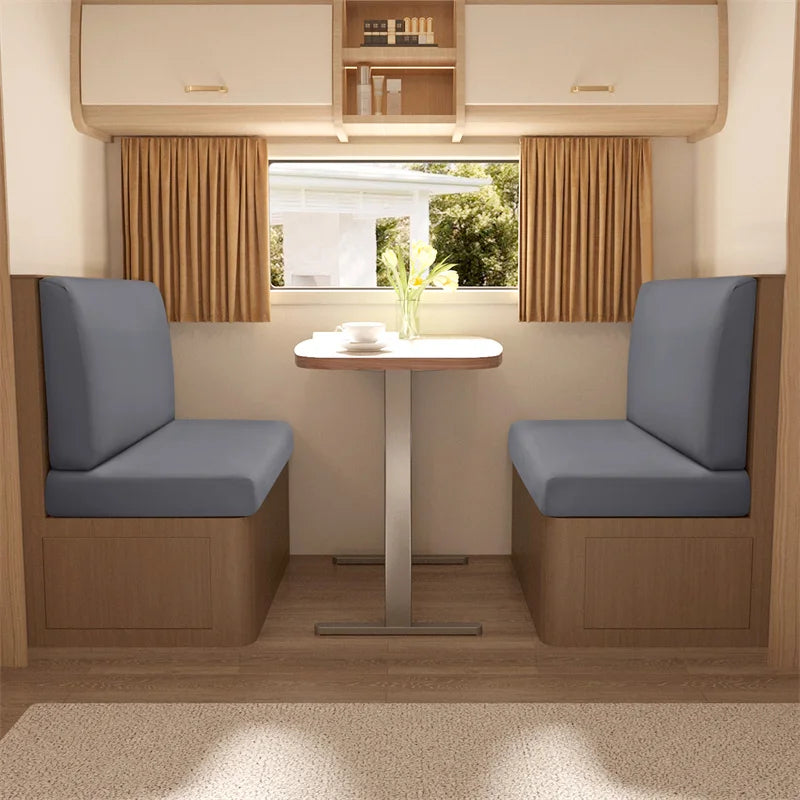 Two upholstered dinette seats with light blue cushions and wooden frames are shown in a modern interior setting.