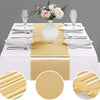 Luxury satin gold table runner set with white plates silverware and floral centerpiece