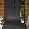 A dark gray modern door with vertical glass panels and a black non-slip rubber doormat in front of it.