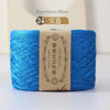 A skein of bright blue bamboo fiber yarn labeled as 24 strands for crafting.