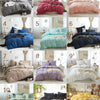 A collection of ten beds featuring soft washed duvet covers in various shades of pink, purple, blue, and green with pom-pom d