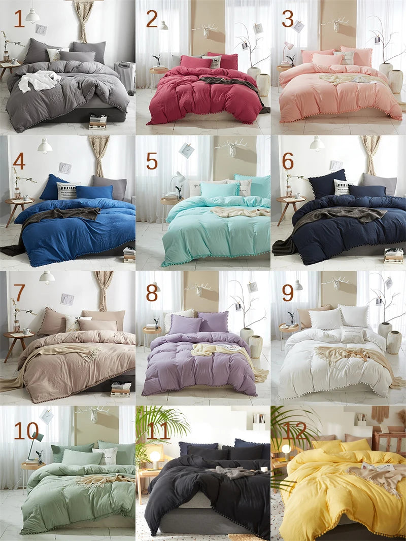 A collection of ten beds featuring soft washed duvet covers in various shades of pink, purple, blue, and green with pom-pom d