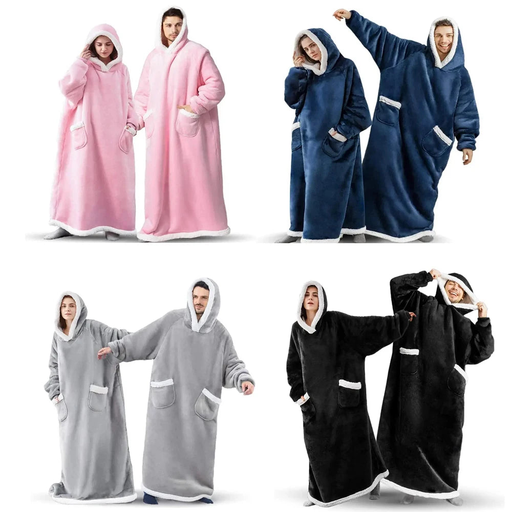 A set of oversized flannel blanket pyjama suits in pink, blue, and black for women and men.