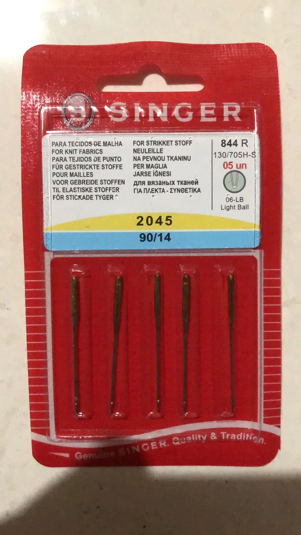 A red packaging box for a Singer sewing needle set labeled 844 R with various language descriptions.