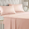 A pink luxury microfiber bed sheet set with decorative piping and deep pockets on a bed.