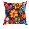 A decorative pillow cover featuring a vibrant, colorful floral pattern with various shades of pink, yellow, orange, and blue.