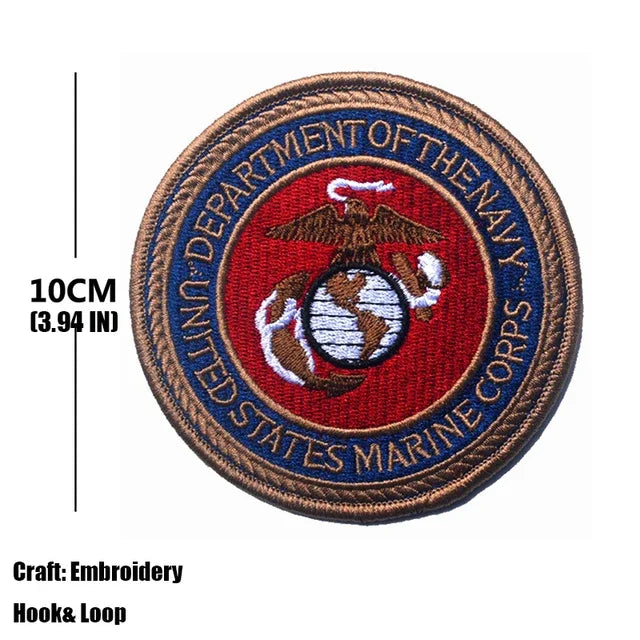 A round embroidered patch for the Department of the Navy, featuring an eagle and globe design.