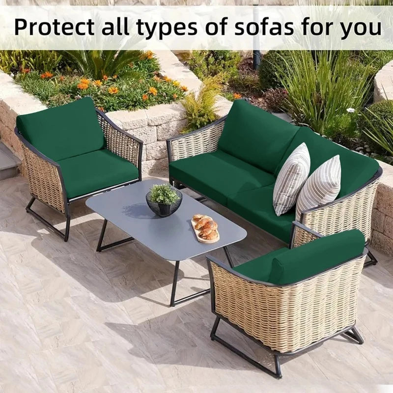 Green outdoor sofa cushion covers protecting wicker sofas in a garden setting.