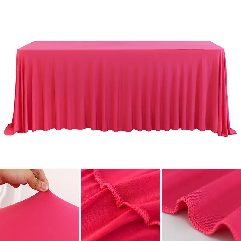 A bright pink stretchable waterproof rectangle tablecloth draped over a table.