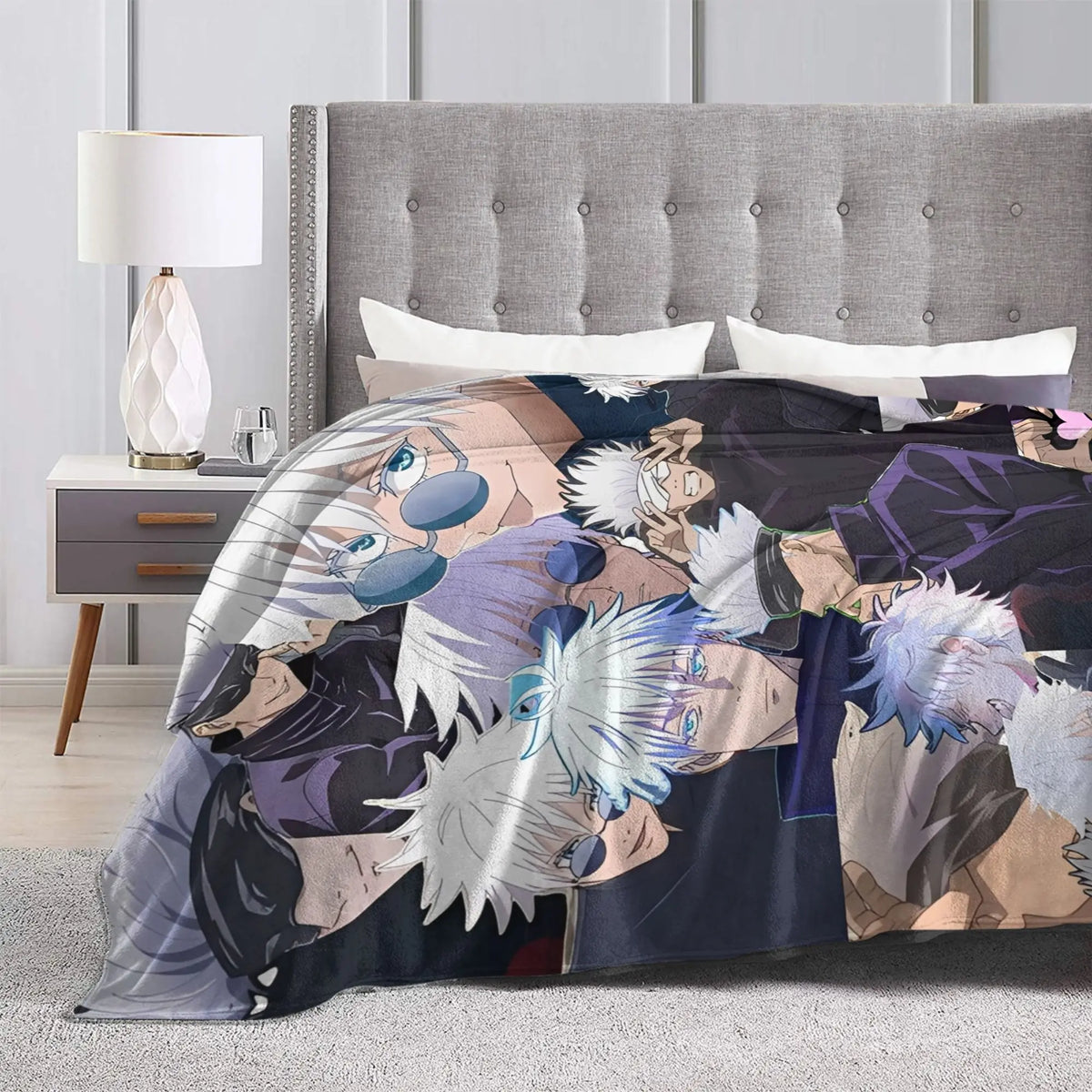 A flannel throw blanket featuring characters from Jujutsu Kaisen, including Gojo Satoru, draped over a bed.